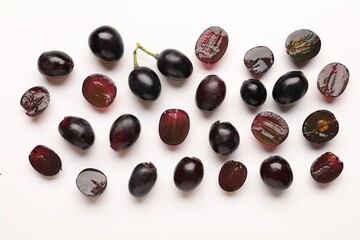 Naklejka premium Fresh ripe grapes on white background, flat lay