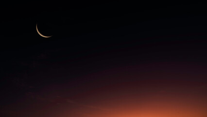 Dusk, Islamic Moon sky on Dark Blue Night sky, Twilight Sky in the Evening with Sunset and Beautiful Sunlight dark cloud and Crescent moon, symbol of religion islamic begin Ramadan month, Eid al-Adha © Nature Peaceful 