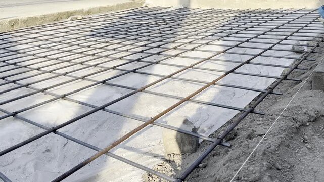 Steel wire mesh rebar grid layout on concrete floor foundation