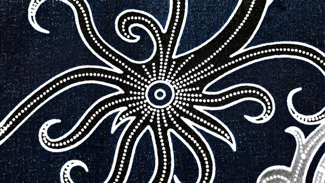Close up of traditional Indonesian batik fabric texturized with elegant tribal ethnic pattern