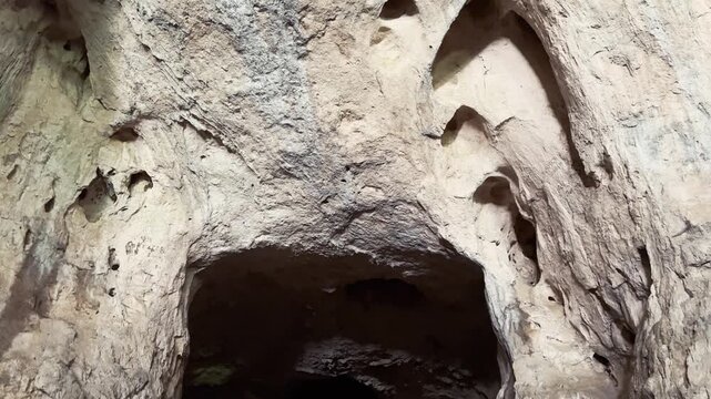 Devetashka cave karst rock texture close up limestone ceiling geological formation Devetaki Lovech Bulgaria nature travel concept