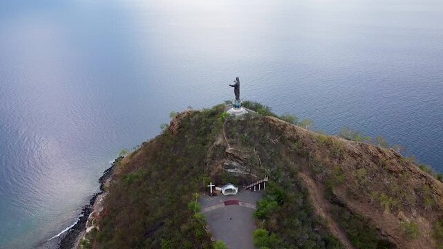 Aerial view high above Cristo Rei statue of Jesus Christ landmark in capital city Dili, Timor-Leste, Southeast Asia