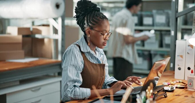 Laptop, woman and typing in startup for logistics admin, delivery scheduling or freight tracking. Ecommerce staff, owner and tech in storage for order processing, online inventory and route planning