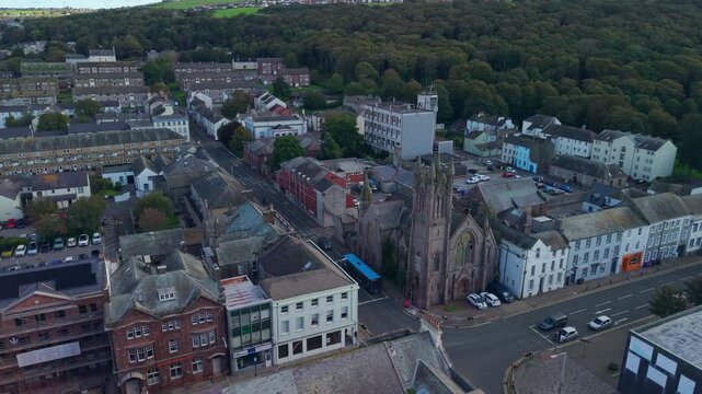 Aerial panoramic views of Whitehaven coastal town and civil parish. Demonstration of old Town architecture with roads and moving vehicles. Drone POV exploration of Devon County, England, UK.