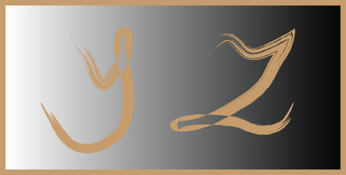 Golden brush stroke letters y and z on gradient background with typography alphabet calligraphy