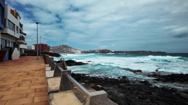 Slow motion waves crashing on rocky coast of El Agujero, Gran Canaria