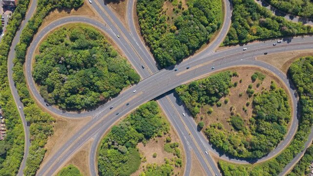 Aerial View of a Large Cloverleaf Highway Interchange With Flowing