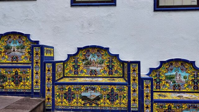 Slow motion pan of ornate azulejo tile benches, Firgas, Gran Canaria