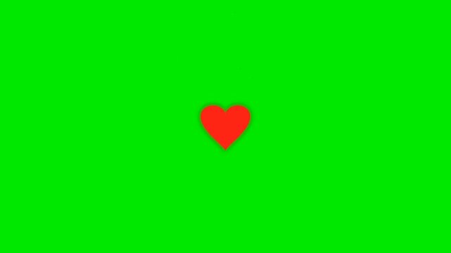 Red heart icon floating on green screen background with small sparkles for video editing compositing.