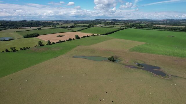 Aerial flight over Boyne Valley farmland towards Newgrange Ireland