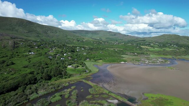 Drone flight over tidal marsh and green valley at Caherdaniel Ireland