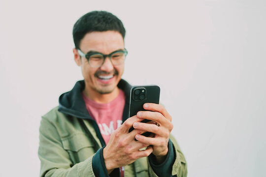 man using mobile phone holding cell phone texting message contact us.chatting,search internet shopping online.device communication connecting