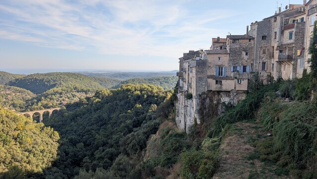Tourrettes-sur-Loup overlooking a wooded valley and viaduct in France. 