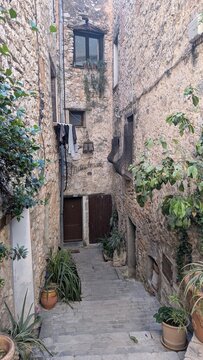 Narrow stone alley in Tourrettes-sur-Loup, France. 