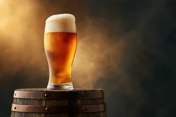 Beer glass with foam on wooden barrel against smoky amber background, Oktoberfest product shot © boule1301