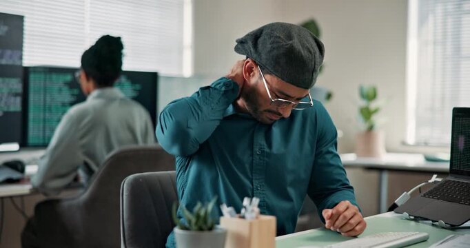 Programmer, computer and neck pain in office with burnout, tired or bad posture of software engineer. Male person, technology and coworking at workplace with sore muscle, exhausted or coding job