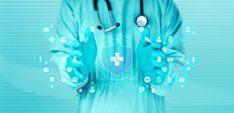 Doctor in green scrubs managing health insurance enrollment via a touchscreen; digital innovation in patient registration and modern surgical health services.