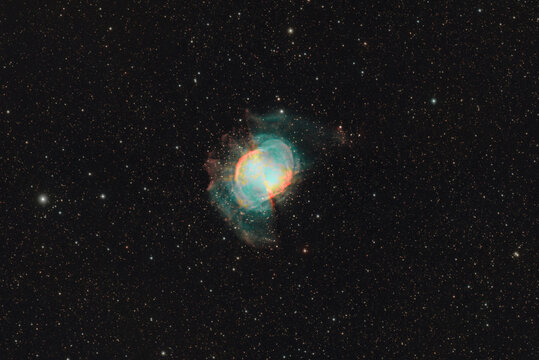 The Dumbbell Nebula (M27) against the backdrop of the starry sky, a deep‑space object.