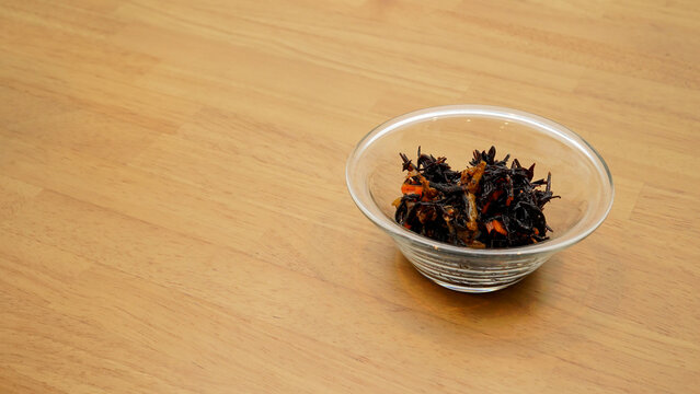 Bowl of simmered hijiki on a wooden table