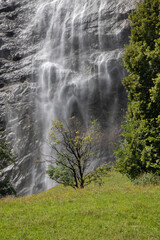 Fototapeta premium Lauterbrunnen valley waterfall cascading down rock face
