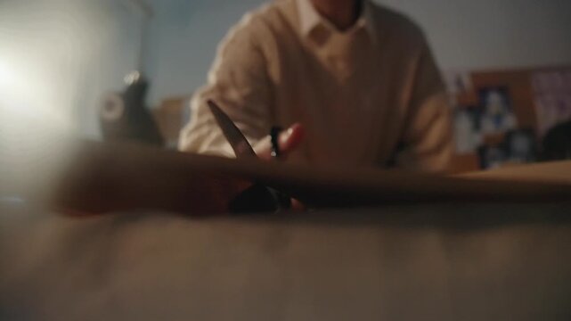Cutting kraft paper with scissors