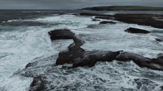Slow Motion Surf Over Rocky Platforms at Kilkee