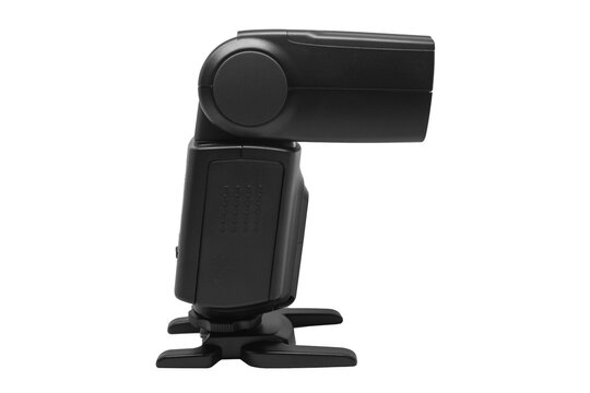 A side view of a black external camera flash speedlight mounted on a hot shoe stand isolated against a clean white background.