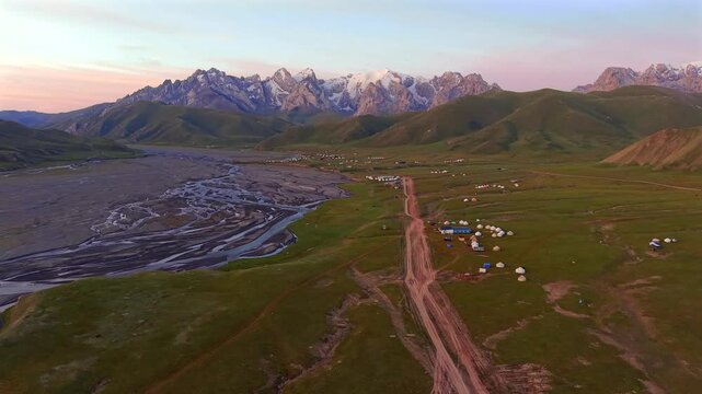 Aerial view of Kok Kiya Valley, braided river, yurts and Kakshaal Too mountains