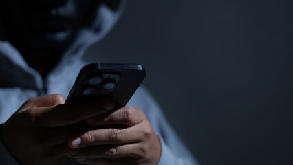 Scammers use phones and personal information to fraudulently obtain money from accounts. © kamonwan
