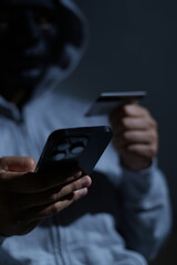 Scammers use phones and personal information to fraudulently obtain money from accounts. © kamonwan