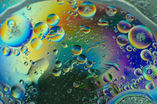 Colorful abstract macro photography of oil drops on water surface