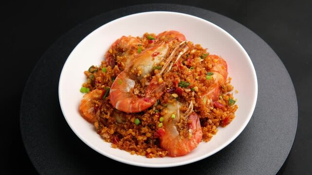 Stir fried river prawn(Giant freshwater prawn) with garlic and salt in white plate.(goong pad prik glua)