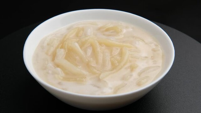 Sweet and salty rice flour dumplings in creamy coconut milk.Thai dessert.(Kanom Pa Grim)