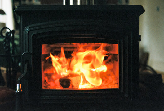 Fire burning in wood stove at home