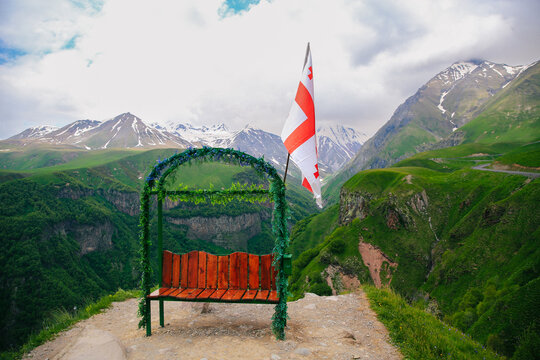 Georgian Flag and Caucasus Mountains