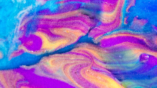 Vibrant abstract fluid texture with neon color swirls
