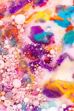 Colorful abstract paint bubbles and fluid texture background
