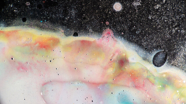 Abstract fluid texture with pastel cosmic nebula effect