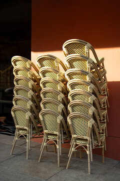 Stacked cafe chairs before opening