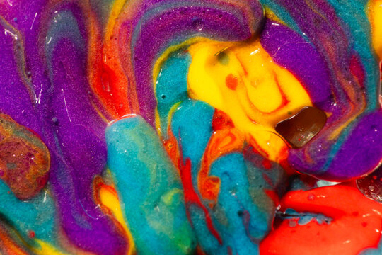 Vibrant abstract paint swirl with colorful liquid texture