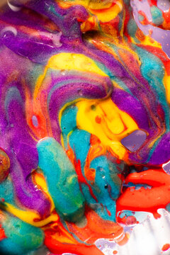 Vibrant abstract paint swirl with colorful liquid texture