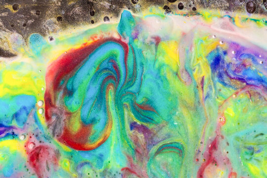 Vibrant fluid paint swirl abstract background texture