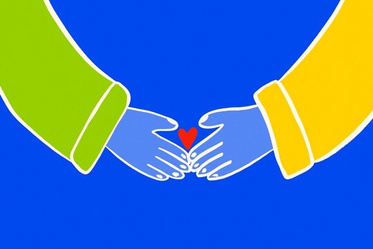 Colorful hands holding heart symbol of love and kindness