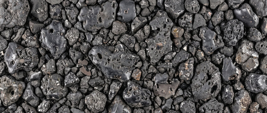 Copper slag industrial byproduct texture background with dark porous glassy volcanic rock texture
