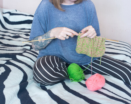 Woman is Knitting At Home