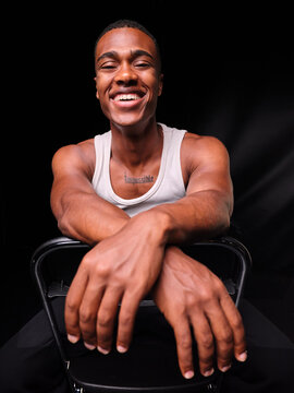 Happy young African American man smiling at camera
