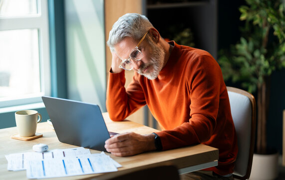 Focused Senior Man Working