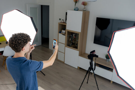 Content creator record video with smartphone in home studio
