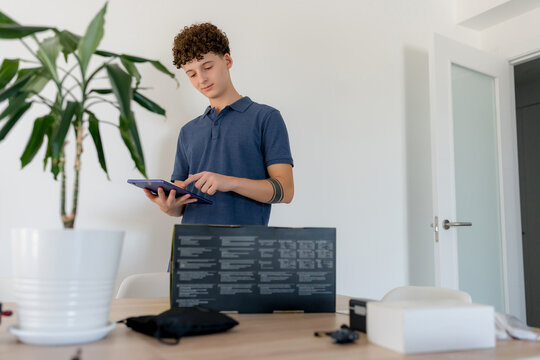 Young content creator use tablet in home office