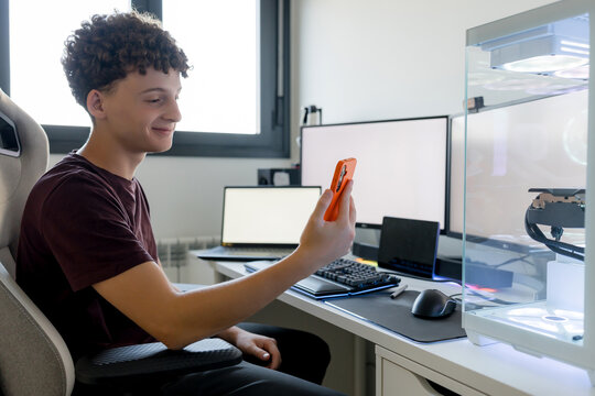 Young man use AI tool beside gaming computer